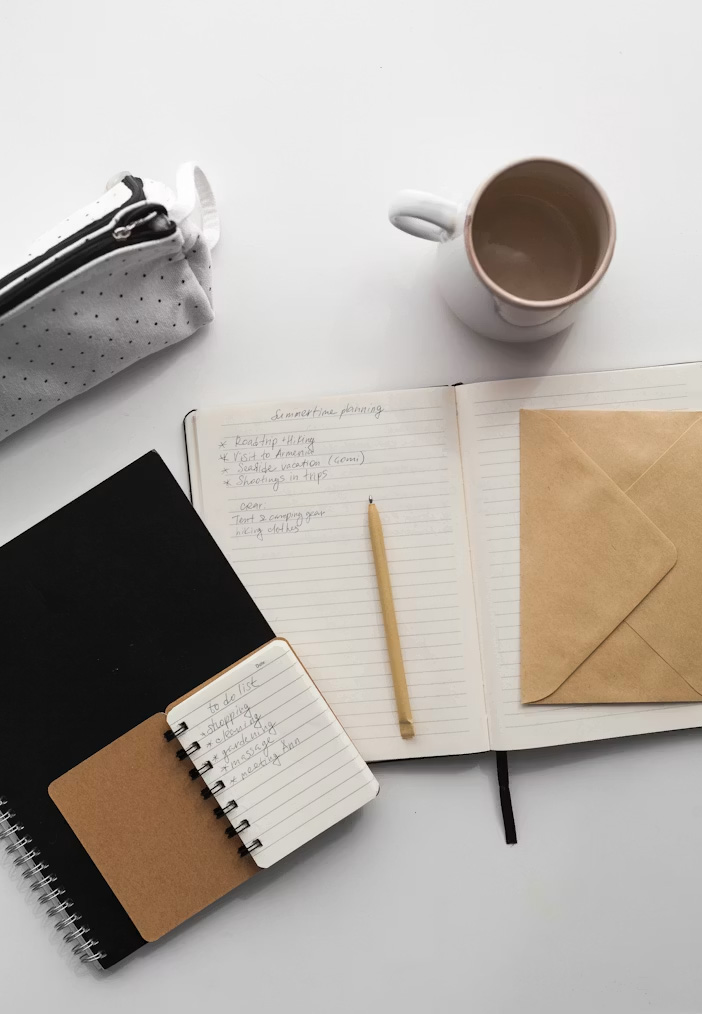 Open book and coffee by a sunlit window — still, simple, present